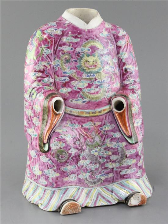 A large Chinese famille rose seated figure of an Emperor, Daoguang period (1821-50), height 30cm, cracks